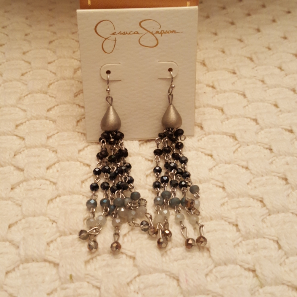 Jessica Simpson long multi color stone earrings.